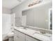 Bathroom with double sink vanity, granite counters, and shower-tub combo at 9188 Jefferson Village Sw Dr, Covington, GA 30014