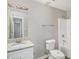 Bright bathroom featuring a white vanity with granite countertop and a shower with tub at 9188 Jefferson Village Sw Dr, Covington, GA 30014