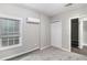 Cozy bedroom with a window, air conditioner, and a closet for organized storage at 9188 Jefferson Village Sw Dr, Covington, GA 30014