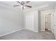 Bedroom with a ceiling fan, large closet, and access to the ensuite bathroom at 9188 Jefferson Village Sw Dr, Covington, GA 30014