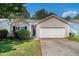 Charming single-Gathering home featuring a two-car garage and a well-manicured front lawn at 9188 Jefferson Village Sw Dr, Covington, GA 30014