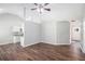Open-concept living space with sleek wood floors, neutral walls, and modern lighting at 9188 Jefferson Village Sw Dr, Covington, GA 30014