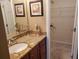 Bathroom vanity with granite countertops and access to a walk-in closet at 1231 Creek Forest Ln, Austell, GA 30106