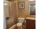 Bathroom featuring a glass enclosed shower and dark wood vanity with granite counters at 1231 Creek Forest Ln, Austell, GA 30106