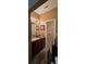 Bathroom vanity with granite counters and a walk-in closet at 1231 Creek Forest Ln, Austell, GA 30106