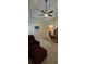 Bedroom featuring a ceiling fan, neutral carpet, and standard closet at 1231 Creek Forest Ln, Austell, GA 30106