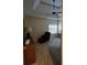 Bedroom with a tray ceiling, ceiling fan, chair, and shuttered windows at 1231 Creek Forest Ln, Austell, GA 30106