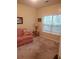 Bedroom with large window and neutral colored walls at 1231 Creek Forest Ln, Austell, GA 30106