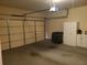 Two-car garage with ample storage space featuring an automatic door and clean layout at 1231 Creek Forest Ln, Austell, GA 30106