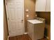 Laundry area with a white washer and dryer, shelving, and storage space at 1231 Creek Forest Ln, Austell, GA 30106