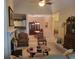 Open-concept living room with neutral paint, dining area, and kitchen access at 1231 Creek Forest Ln, Austell, GA 30106