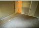 Bedroom needing renovation featuring neutral walls, carpeted floors, and access to a closet at 145 Huntcliff Ct, Fayetteville, GA 30214
