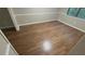 Bright bedroom featuring hardwood floors, neutral walls, and a window providing natural light at 145 Huntcliff Ct, Fayetteville, GA 30214