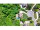 Aerial view of the home on a 1.65 acre lot surrounded by mature trees at 255 Ashmere Ct, Tyrone, GA 30290