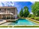 Beautiful backyard with an in-ground pool, integrated hot tub, and a lush green lawn at 255 Ashmere Ct, Tyrone, GA 30290