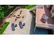 Overhead view showcasing patio, fire pit, outdoor seating, and well-manicured landscaping at 255 Ashmere Ct, Tyrone, GA 30290