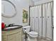 Charming bathroom with updated vanity and decorative shower curtain at 255 Ashmere Ct, Tyrone, GA 30290