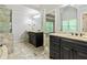 Spacious bathroom featuring a luxurious soaking tub, and vanity, and glass shower at 255 Ashmere Ct, Tyrone, GA 30290