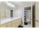 Well-lit bathroom showcasing a vanity with granite countertops and modern white cabinets at 255 Ashmere Ct, Tyrone, GA 30290