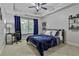 Relaxing bedroom showcasing a plush bed, desk, and shelving at 255 Ashmere Ct, Tyrone, GA 30290