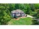 Charming two-story home featuring a landscaped yard, a welcoming porch, and beautiful architectural details at 255 Ashmere Ct, Tyrone, GA 30290