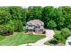 Beautiful home with a lush lawn, mature trees, and a refreshing pool providing a private oasis at 255 Ashmere Ct, Tyrone, GA 30290