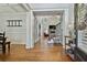Bright foyer with hardwood floors, open staircase, and decorative accents for a welcoming entrance at 255 Ashmere Ct, Tyrone, GA 30290