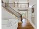 Elegant foyer with hardwood floors, staircase, and a view of the front entrance at 255 Ashmere Ct, Tyrone, GA 30290