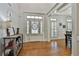 Inviting foyer with a wood floor, white door and trim, and stylish décor for a classic look at 255 Ashmere Ct, Tyrone, GA 30290