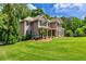 Beautifully landscaped two-story home with manicured lawn and traditional architectural details at 255 Ashmere Ct, Tyrone, GA 30290