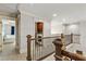 Hallway features a laundry room with modern machines and access to the upper level at 255 Ashmere Ct, Tyrone, GA 30290