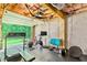 Personal gym with exposed ceiling, garage door, and fitness equipment for at-home workouts at 255 Ashmere Ct, Tyrone, GA 30290