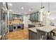 Gourmet kitchen boasts stainless steel appliances, granite countertops, and pendant lighting over a breakfast bar at 255 Ashmere Ct, Tyrone, GA 30290