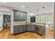 Well-appointed kitchen with granite countertops, stainless steel appliances, custom cabinets, and hardwood flooring at 255 Ashmere Ct, Tyrone, GA 30290