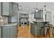 Modern kitchen featuring custom cabinets, stone countertops, and stainless-steel appliances at 255 Ashmere Ct, Tyrone, GA 30290