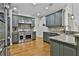 Beautiful kitchen with stone countertops, stainless steel appliances, and custom cabinetry at 255 Ashmere Ct, Tyrone, GA 30290
