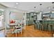 Spacious open-concept kitchen and dining area with blue-gray cabinets and bar stool seating at 255 Ashmere Ct, Tyrone, GA 30290
