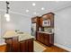 Kitchenette boasts granite countertops, stainless steel appliances, and dark wood cabinets at 255 Ashmere Ct, Tyrone, GA 30290