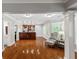 An open-concept living room with an adjacent kitchenette is filled with natural light at 255 Ashmere Ct, Tyrone, GA 30290