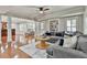 Spacious living room with hardwood floors and a large sofa at 255 Ashmere Ct, Tyrone, GA 30290