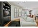 Bright living room boasts hardwood flooring, white couch and neutral tones at 255 Ashmere Ct, Tyrone, GA 30290