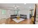 Spacious living room with hardwood floors, neutral paint, and a comfortable gray sectional couch at 255 Ashmere Ct, Tyrone, GA 30290