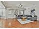 Comfortable living room with hardwood floors, an elegant sofa, and a decorative coffee table at 255 Ashmere Ct, Tyrone, GA 30290
