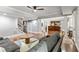 Open-concept living room with hardwood floors flows seamlessly into a kitchen with dark wood cabinets at 255 Ashmere Ct, Tyrone, GA 30290
