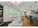 Open-concept living room flowing into the kitchen with hardwood floors and ample natural light at 255 Ashmere Ct, Tyrone, GA 30290