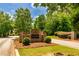 Maple Shade community entrance sign surrounded by manicured bushes at 255 Ashmere Ct, Tyrone, GA 30290