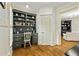 Built-in office nook features custom cabinetry and shelving, adjacent to the living area at 255 Ashmere Ct, Tyrone, GA 30290