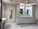 Bright bathroom features double vanity, marble floors, and a neutral color palette at 1345 Starboard Way, Cumming, GA 30041
