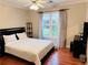 Bedroom features a ceiling fan and natural light coming through the windows at 1345 Starboard Way, Cumming, GA 30041