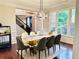 Formal dining room features elegant lighting, wainscoting, and large windows at 1345 Starboard Way, Cumming, GA 30041